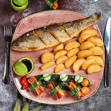 Roasted Fish And Potatoes, Served On Tray. Overhead