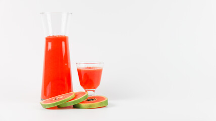 Papaya smoothie in glass jar and glasses on white background diet vegetarian healthy and freshness drink concept soft and selective focus