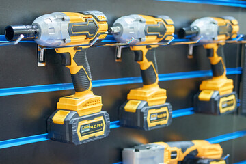 A professional tool for work, repair and construction in the store. Sale of wired power tools and battery powered equipment in the shop