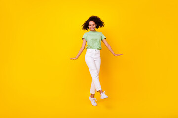 Fototapeta na wymiar Full size photo of young adorable gorgeous nice pretty woman dancing beaming cute celebrate disco isolated on yellow color background