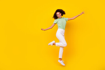 Fototapeta na wymiar Full size photo of young attractive gorgeous nice pretty woman dancing celebrating jump air pms period isolated on bright yellow color background