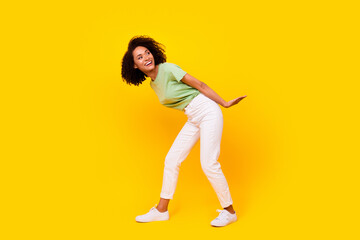 Fototapeta na wymiar Full length photo of young pretty gorgeous nice woman wear casual clothes look curious empty space positive advert isolated on yellow color background