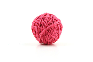 Pink cotton thread ball isolated on white background.