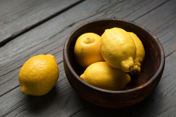 Juicy lemons on a wooden background
