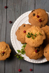 Berry Christmas muffins with lingonberries in a plate, top view