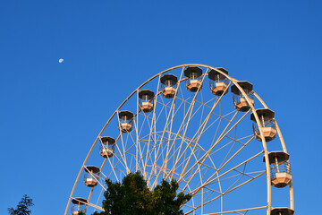 Switzerland, Geneva. Early morning moon and Ferris wheel. August 16, 2022.