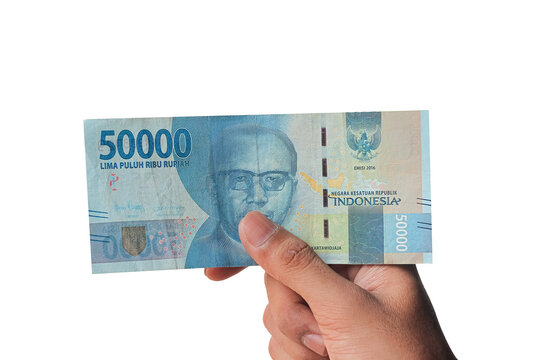 man's hand showing 50,000 thousand rupiah isolated on white background