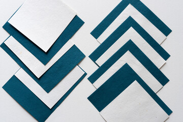 abstract blue and white paper cards on blank paper