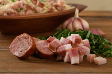  bacon, sausage, cabbage, farofa ingredients, a typical brazilian dish