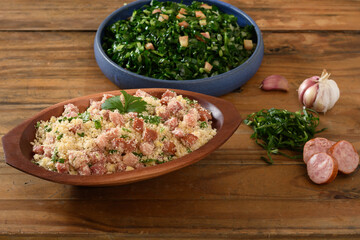 farofa with sausage, bacon and cabbage, typical Brazilian food, wood background	