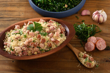 farofa with sausage, bacon and cabbage, typical Brazilian food, wood background	
