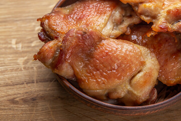 fried chicken meat with appetizing skin in oil
