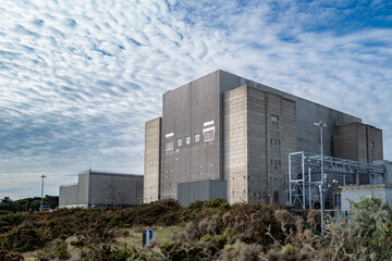 De-commissioned nuclear power generation plant showing is concrete structure and rusted metal...