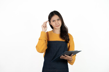 Happy young asian woman business owner wear apron and holding digital tablet for checking order...