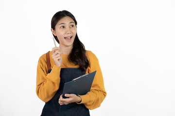 Happy young asian woman business owner wear apron and holding digital tablet for checking order...
