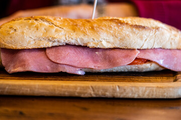 Close up, York ham on a sandwich, on a wooden table