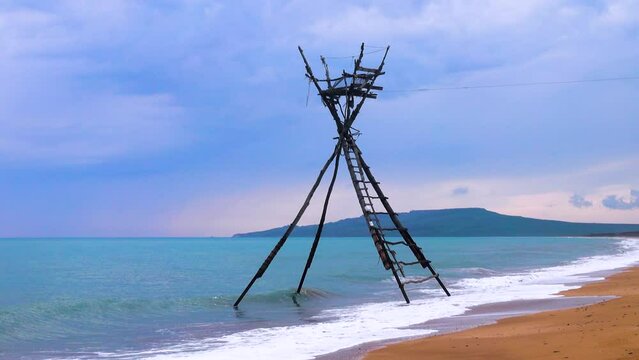 Traditional fishery. Ancient Greeks built such towers in north of Black Sea and were called Thynoscopus. Towers are designed to monitor approach of flocks of mackerel to shores. Crimea fishing now