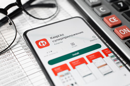 Kaspi Bank of Kazakhstan electronic payment system financial mobile application in online store on smartphone screen at workplace. Astana, Kazakhstan 04.12.2022