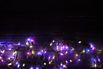 Christmas neon lights on dark wooden background