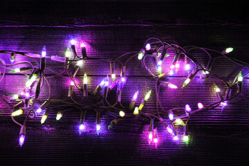 Christmas neon lights on dark wooden background