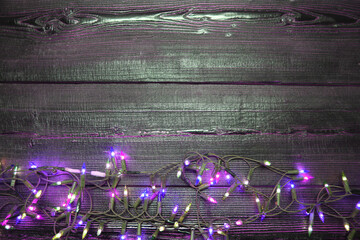 Christmas neon lights on dark wooden background