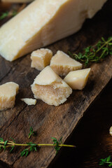Parmesan cheese on a dark background close-up