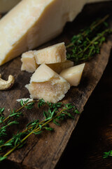 Parmesan cheese on a dark background close-up
