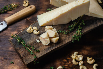 Parmesan cheese on a dark background close-up
