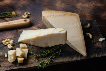 Parmesan cheese on a dark background close-up