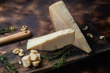 Parmesan cheese on a dark background close-up