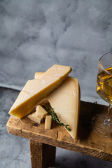 Parmesan cheese on a dark background close-up