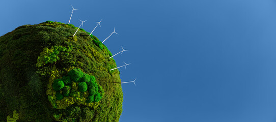 Model of the green planet Earth from moss with wind turbines. Symbol of sustainable development and...