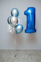 set of blue helium balloons and foil figure balloon number one