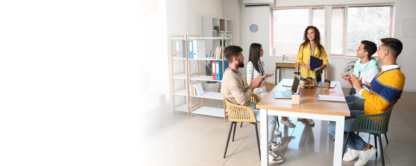 Young African-American woman giving presentation in office. Banner for design
