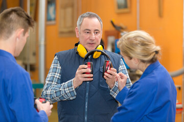 portrait of teacher putting ear-protection