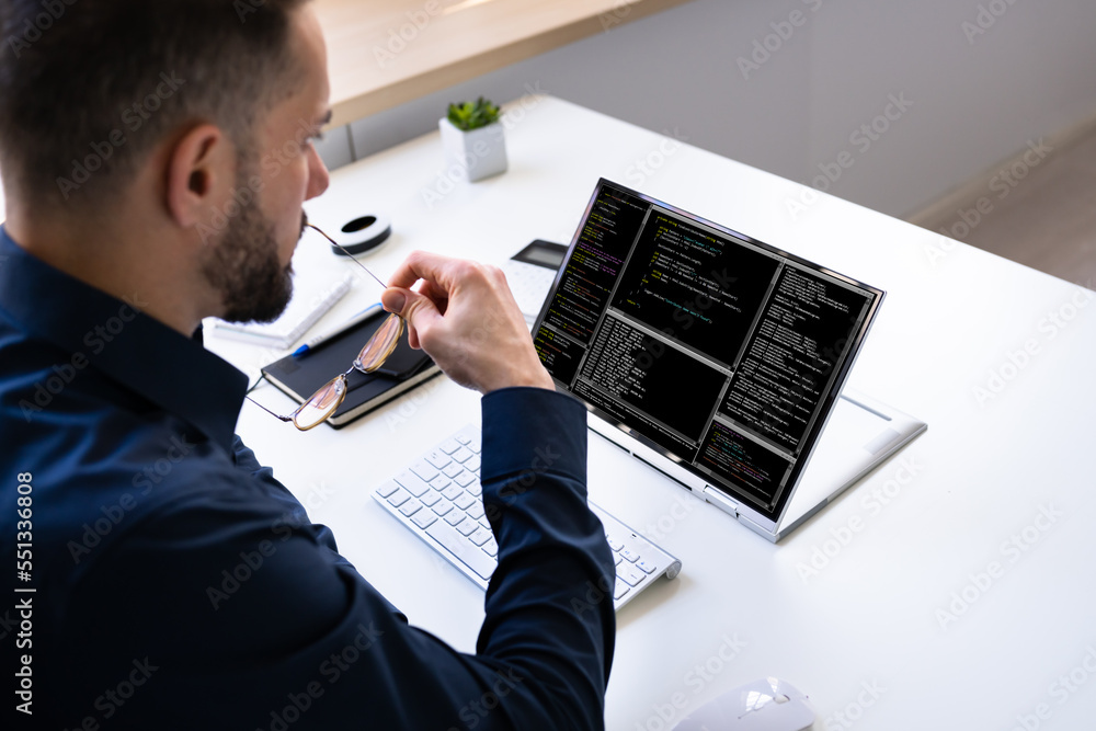 Poster Programmer Or Coder At Office Desk