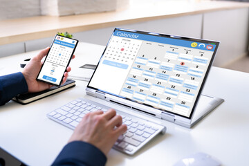 Man Organizing Appointment Schedule Using Cellphone