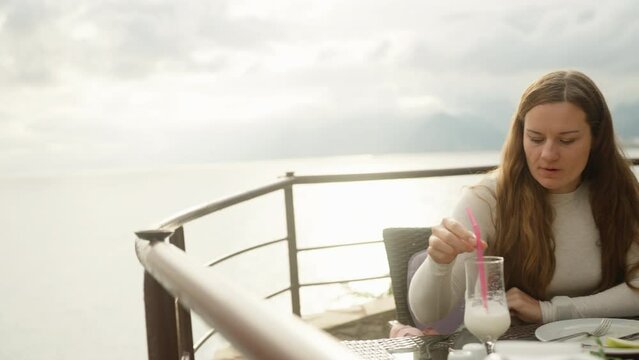 restaurant, sea, cliff, mountain, date, valentine, love, dinner, cocktail, terrace, clouds, girl, edge, cloudy, weather, loneliness, drinking, glare, water, woman, vacation, holiday, resort, young, lu
