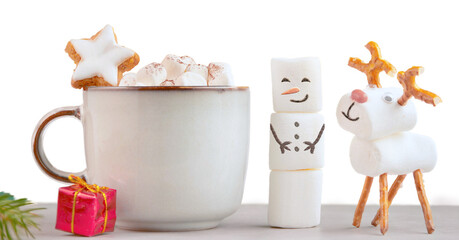 Christmas mug with hot chocolate, marshmallows and red gift box. XMas stars cookies and marshmallow snowman. christmas festive banner with yellow glittering background, copy space for text.