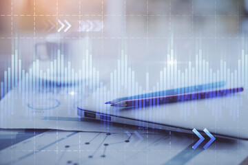 Forex graph hologram on table with computer background. Double exposure. Concept of financial markets.