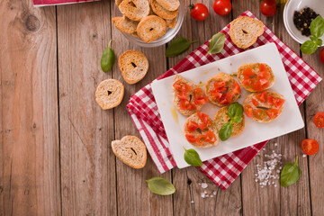 Friselle with cherry tomatoes and basil.