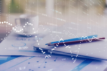 Double exposure of table with computer on background and data theme hologram. Data technology concept.