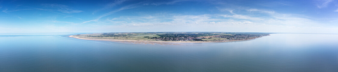 Fototapeta na wymiar birds eye view above the sea looking at the coastline of england