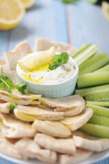 Tzatziki, Greek dip sauce with pita and cucumbers	