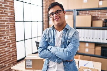 Down syndrome man ecommerce business worker standing with arms crossed gesture at office