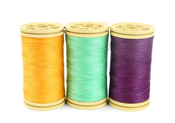 Colorful thread spools isolated on white background