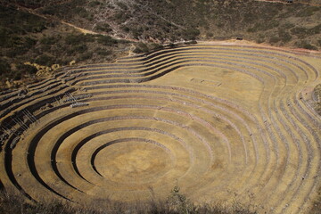 Fototapeta na wymiar Moray is one of the famous Inca ruins near Cusco. It is composed of three groups of circular terraces (muyus in Quechua) that descend 490 feet (150 meters) from the highest terrace to the lowest.