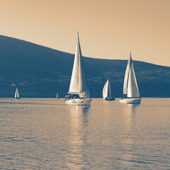Fototapeta premium Sailing boats on water. Montenegro, Bay of Kotor. Color tinting