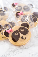 Panda shaped shortbread cookies with chocolate icing