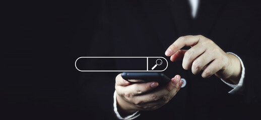 Businessman using mobile phone to search, white search engine bar information search technology...